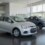 Chevrolet Sonic positioned ahead of Renault Kardian at car dealership showroom representing May sales rankings