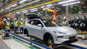 Geely EX2 electric SUV in automotive production line at Brazilian factory facility