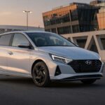 Hyundai i20 compact SUV in urban setting, modern automotive design showcasing front and side profile