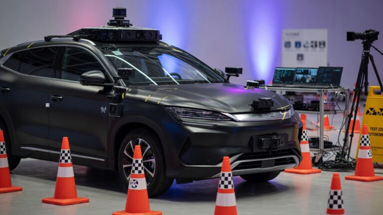 BYD electric vehicle equipped with autonomous driving sensors and safety technology in professional test environment
