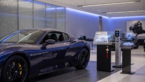 Maserati luxury vehicle in modern showroom setting representing potential business acquisition interest