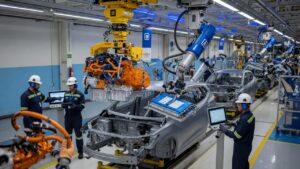 Modern automotive assembly line showing hybrid vehicle production in Brazilian GM factory with robotic equipment and workers
